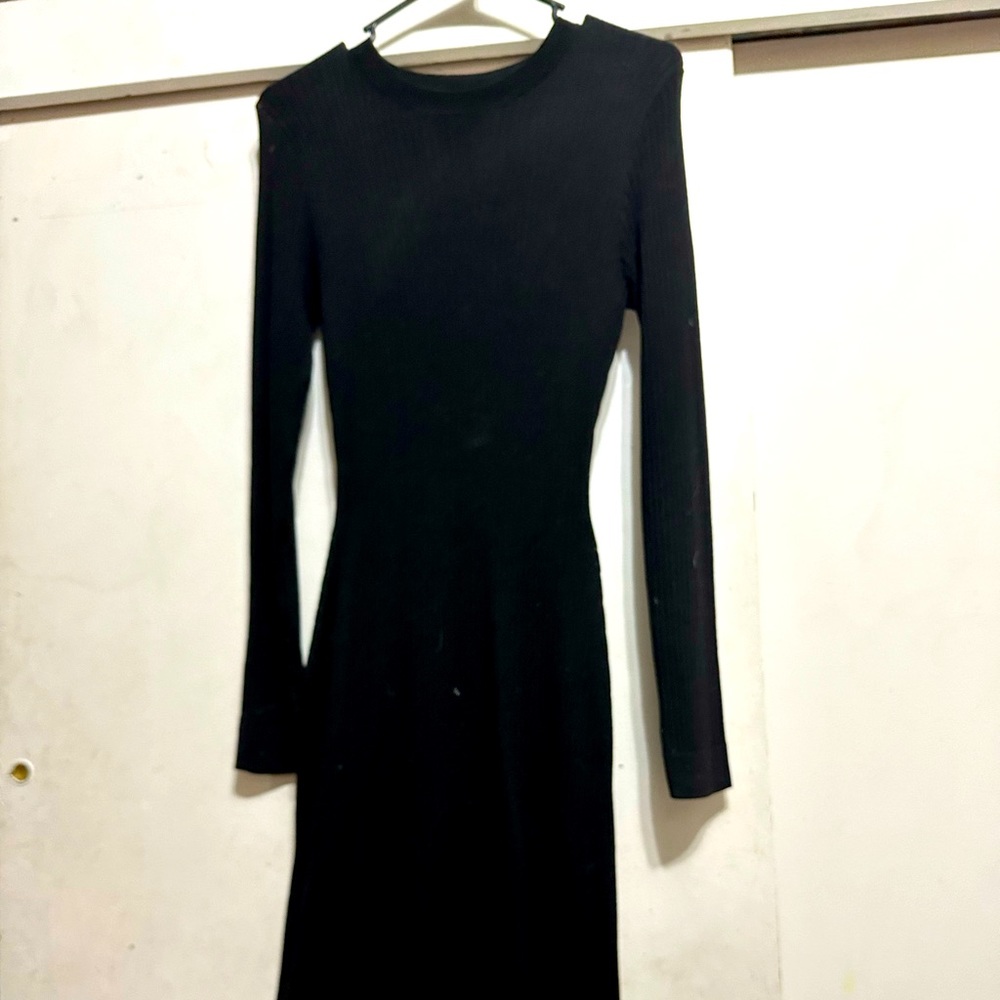 long sleeve long black dress with a slit up the side from H&M. Its size medium